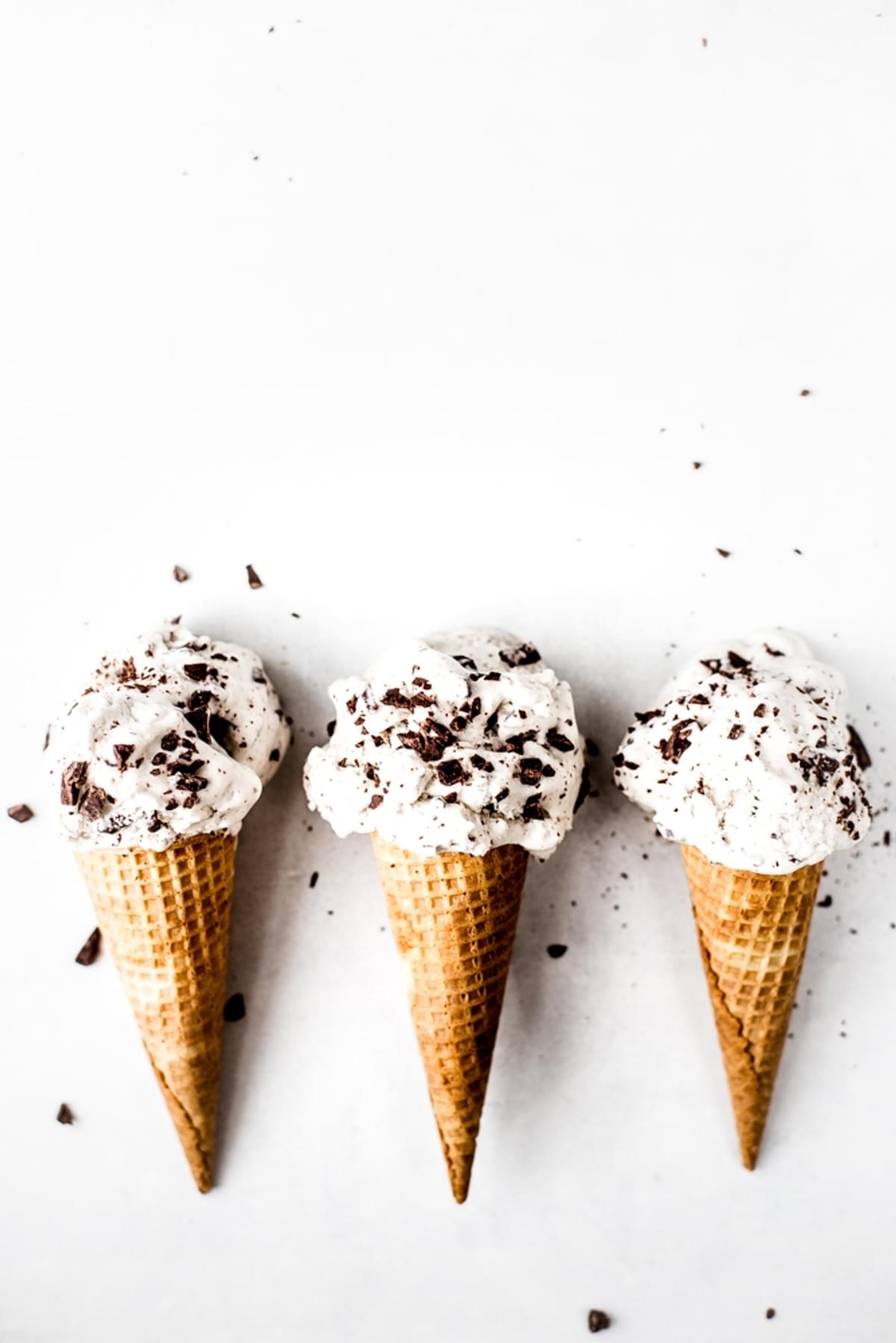 three ice cream cones filled with Vegan Mint Chip Ice Cream