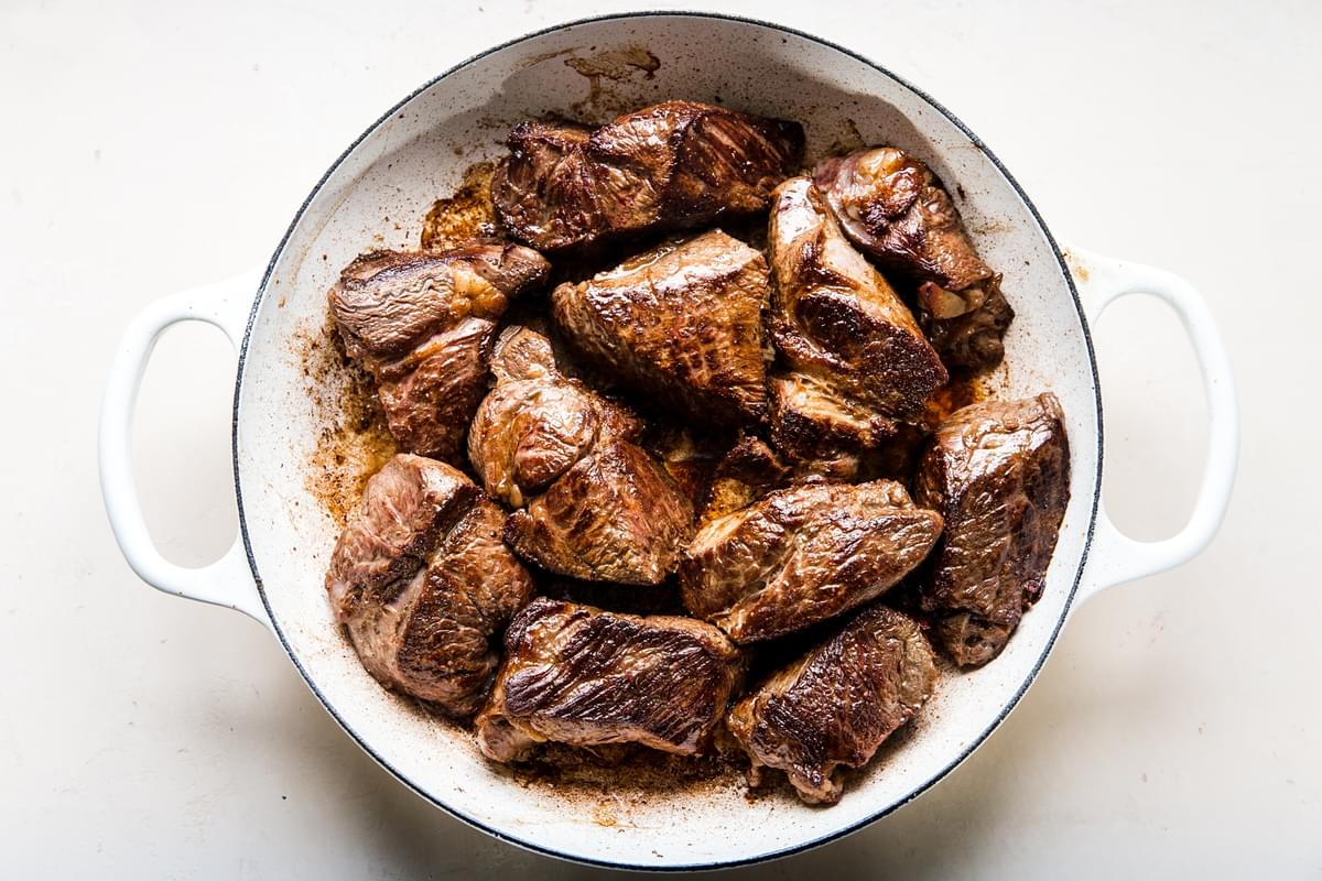 large pieces of chuck roasted browned in a braiser