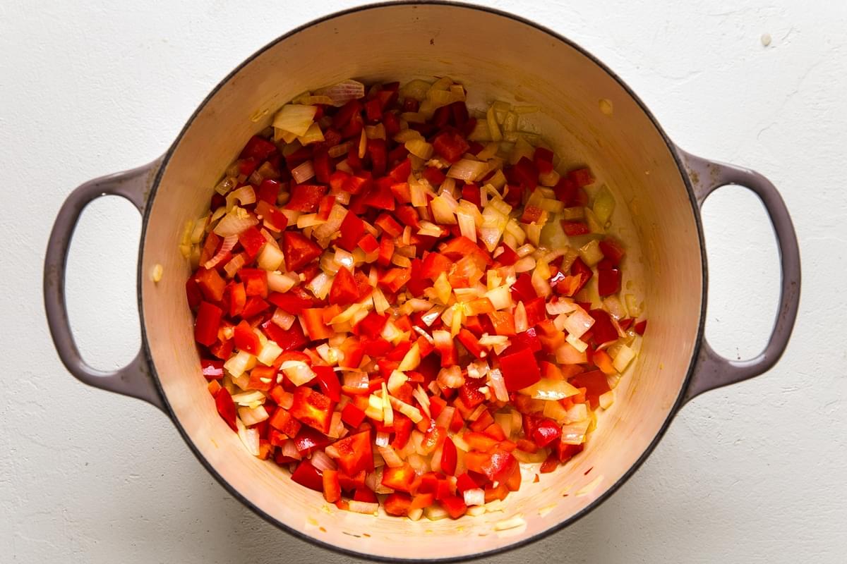 red peppers and onions in a large pot