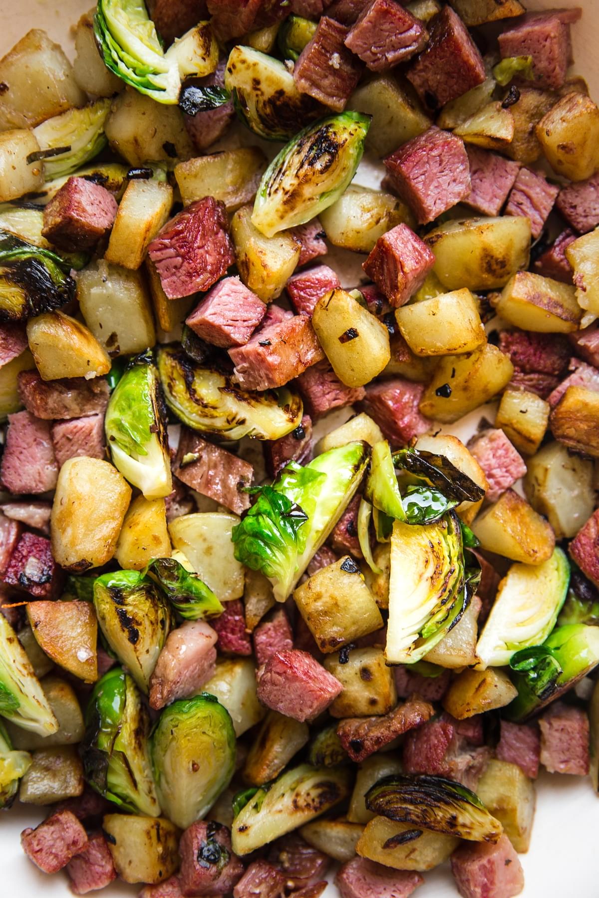 corned beef hash made with potatoes, shallots, brussels sprouts, cream, worcestershire and spices
