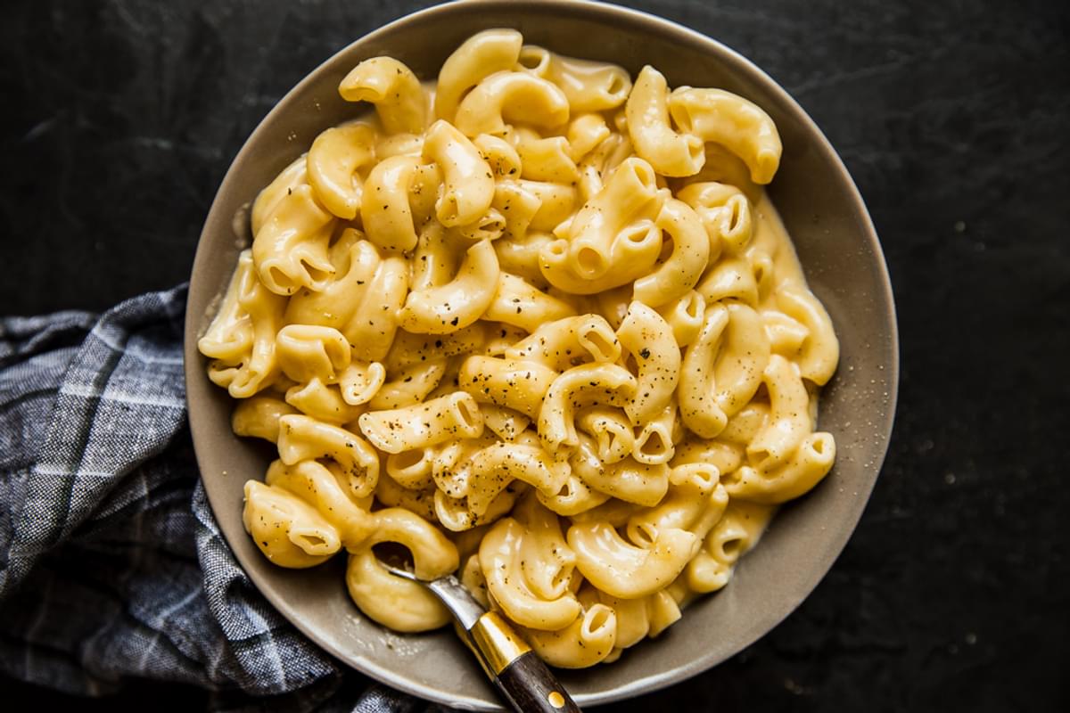 Instant pot mac and cheese in a bowl with a spoon