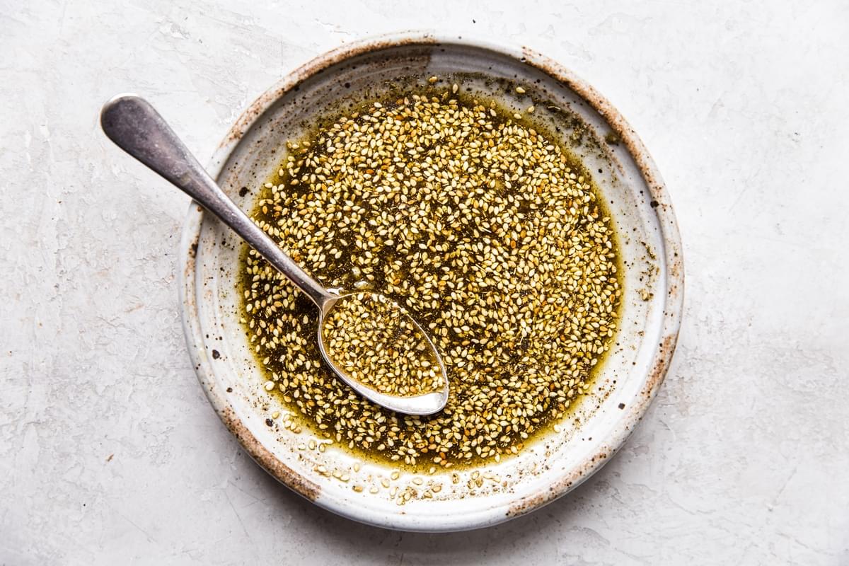 za'atar and oil in a shallow bowl with a spoon
