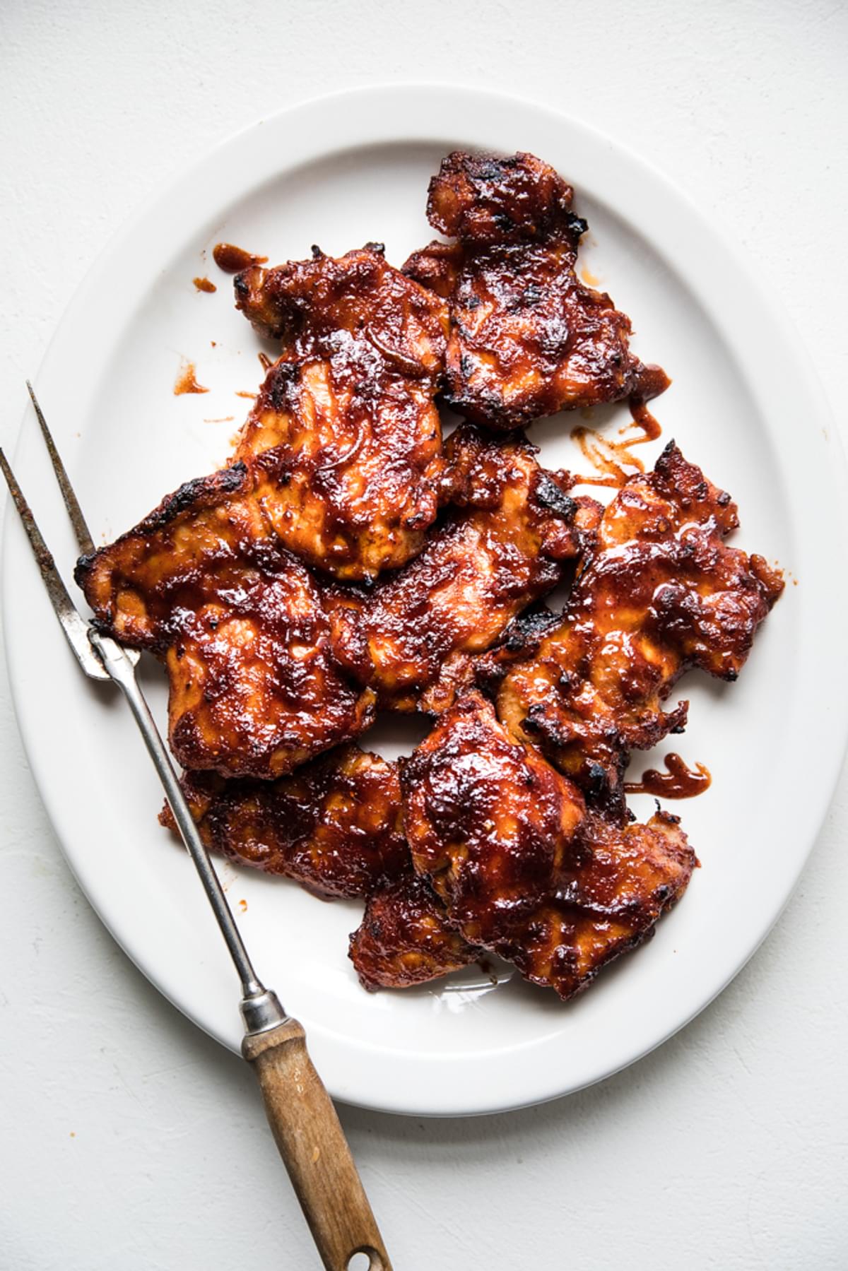 Baked BBQ Chicken Thighs on a white platter
