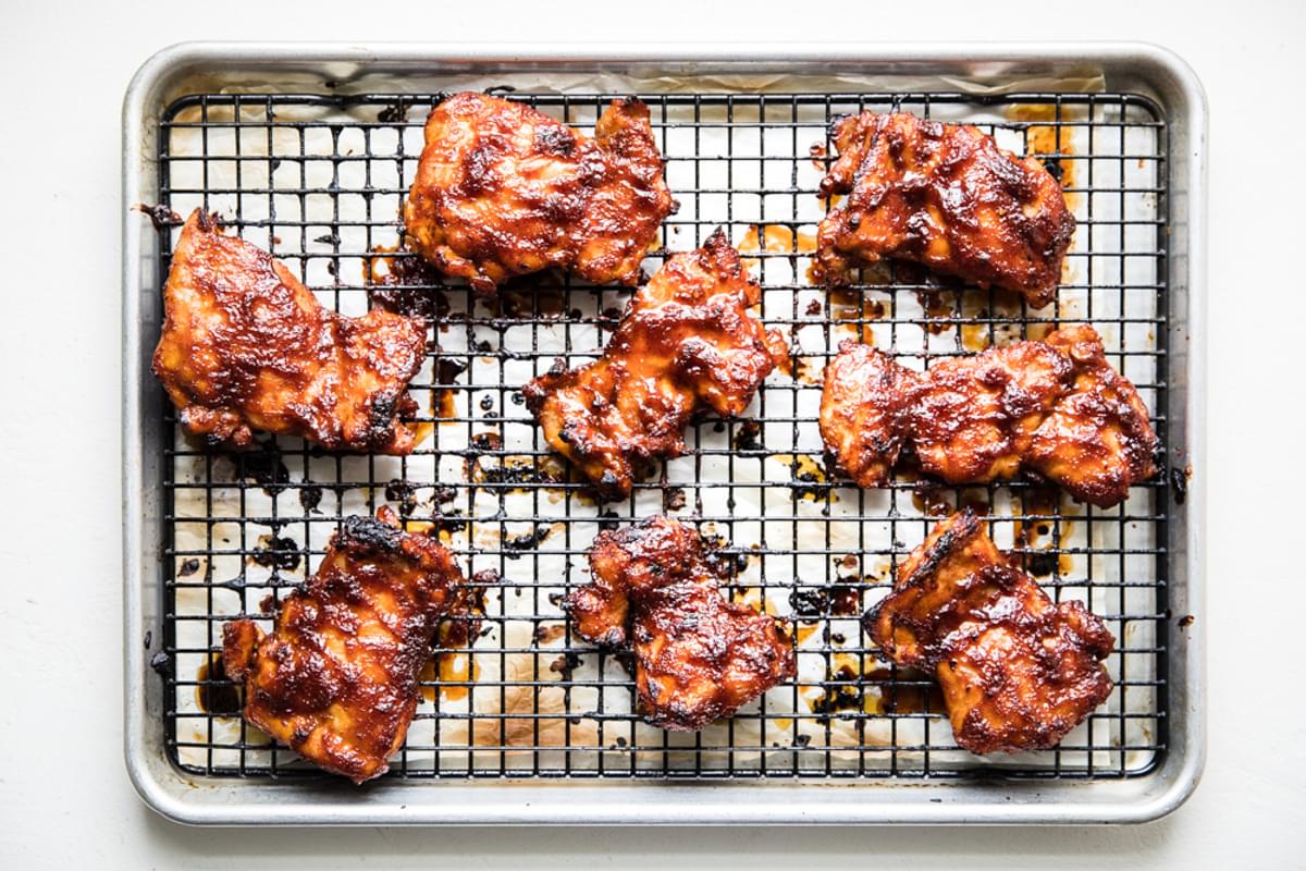 BBQ Chicken Thighs baked on a wire rack in the oven