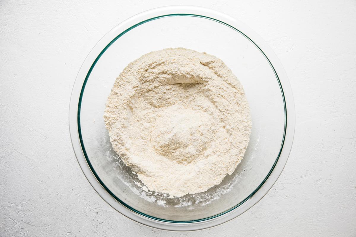 flour, cornmeal, baking powder, baking soda and salt in a bowl for cornbread