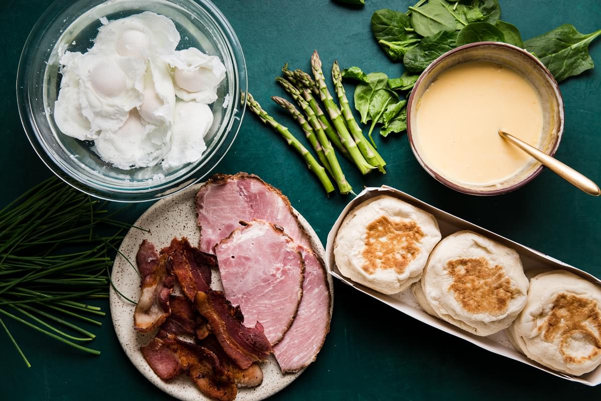 poached eggs, english muffins, asparagus, ham, spinach , bacon, chives, and hollandaise sauce for eggs benedict