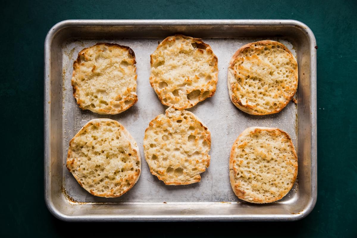 toasted English muffins on a baking