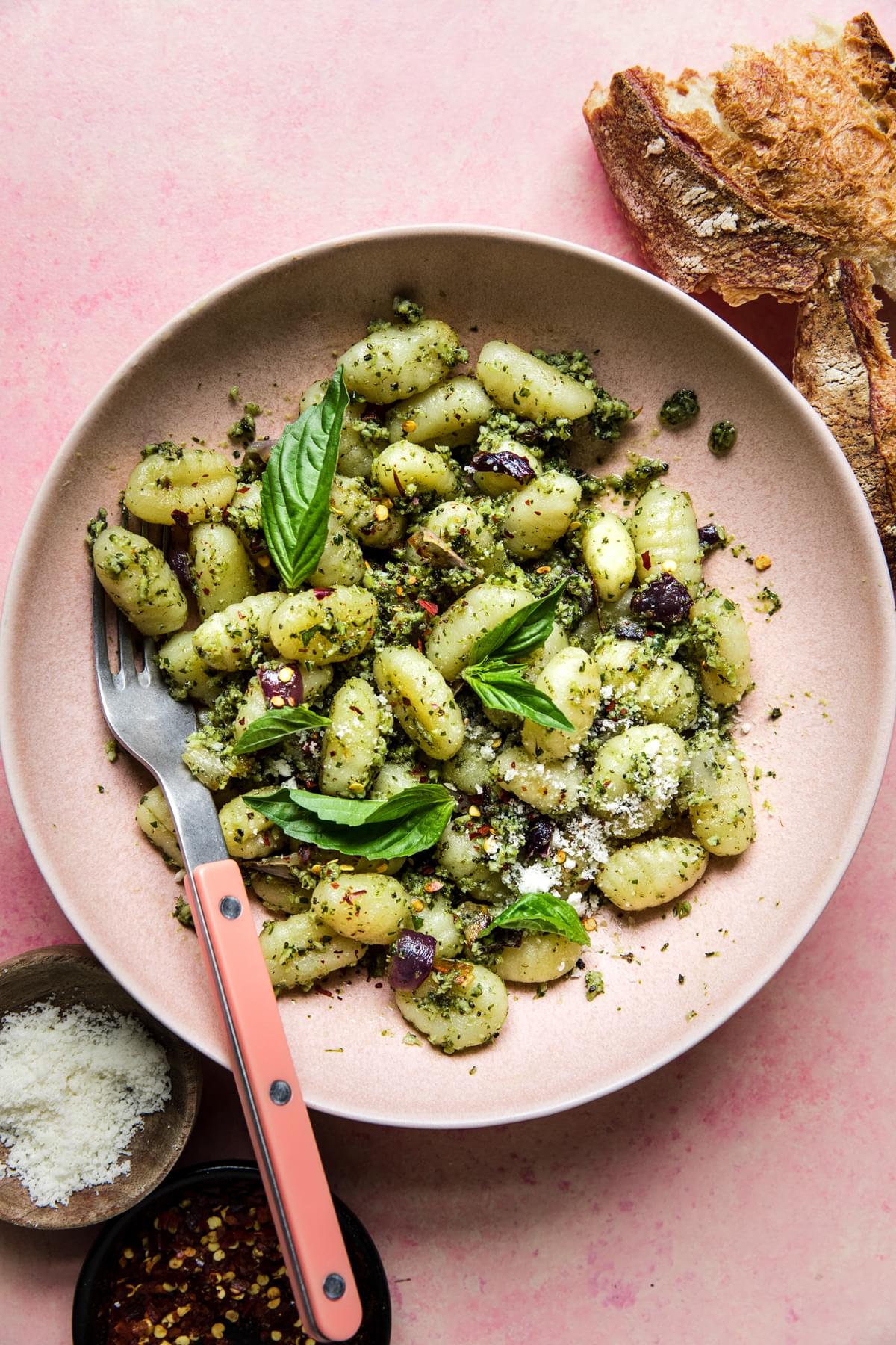 Sheet Pan Gnocchi with Roasted Broccoli Pesto in a bowl with a spoon