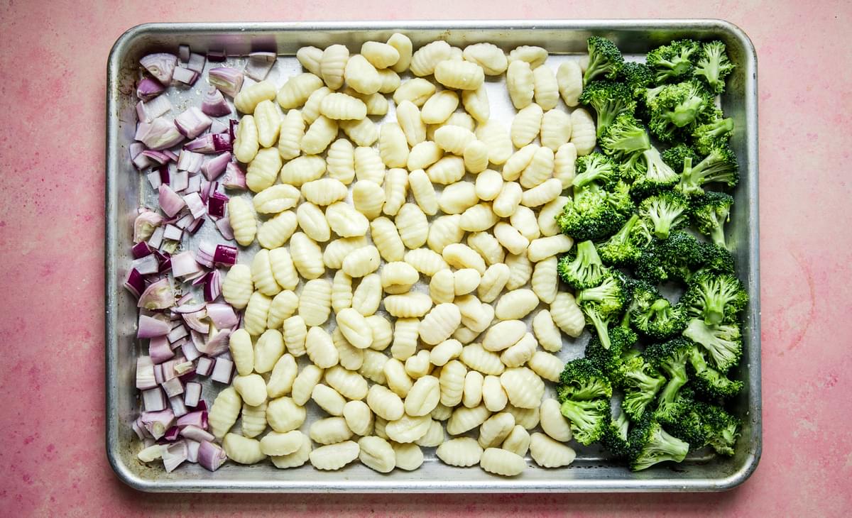 broccoli, gnocchi and red onion on a sheet pan