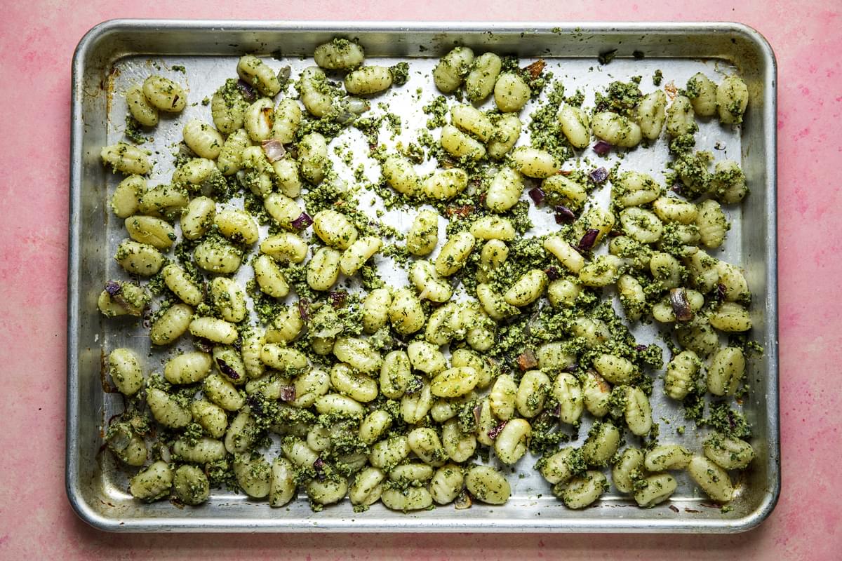 roasted broccoli pesto tossed with gnocchi on a sheet pan