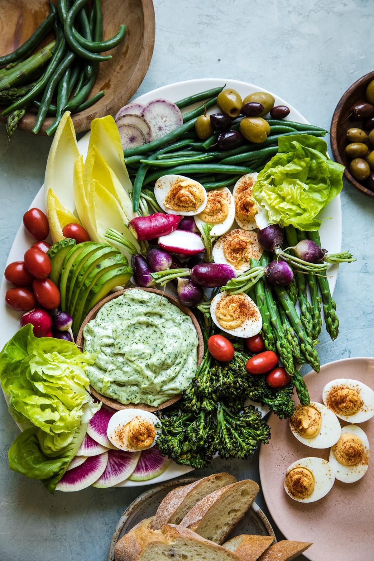 green goddess aioli spread with vegetables on a plate