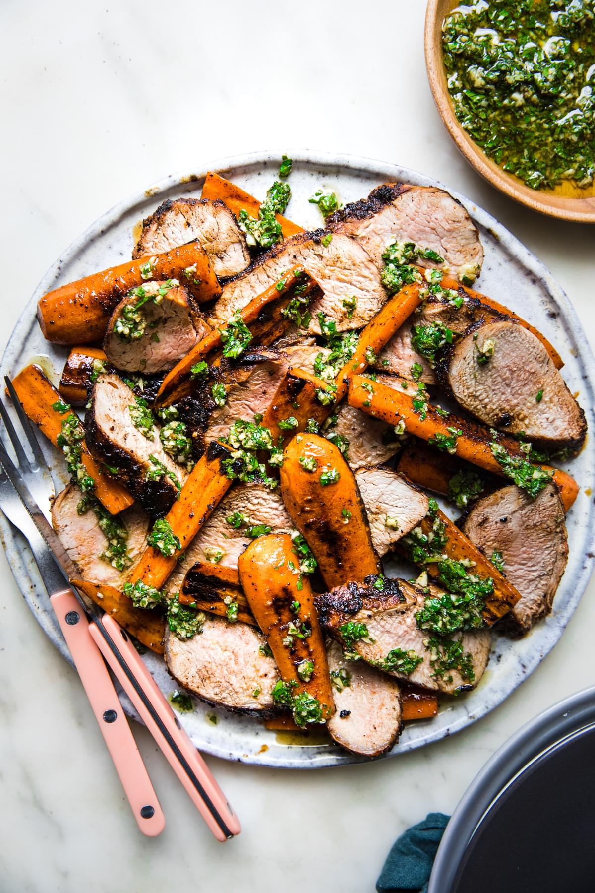 Grilled Pork Tenderloin with Carrots on a plate with cilantro Chermoula