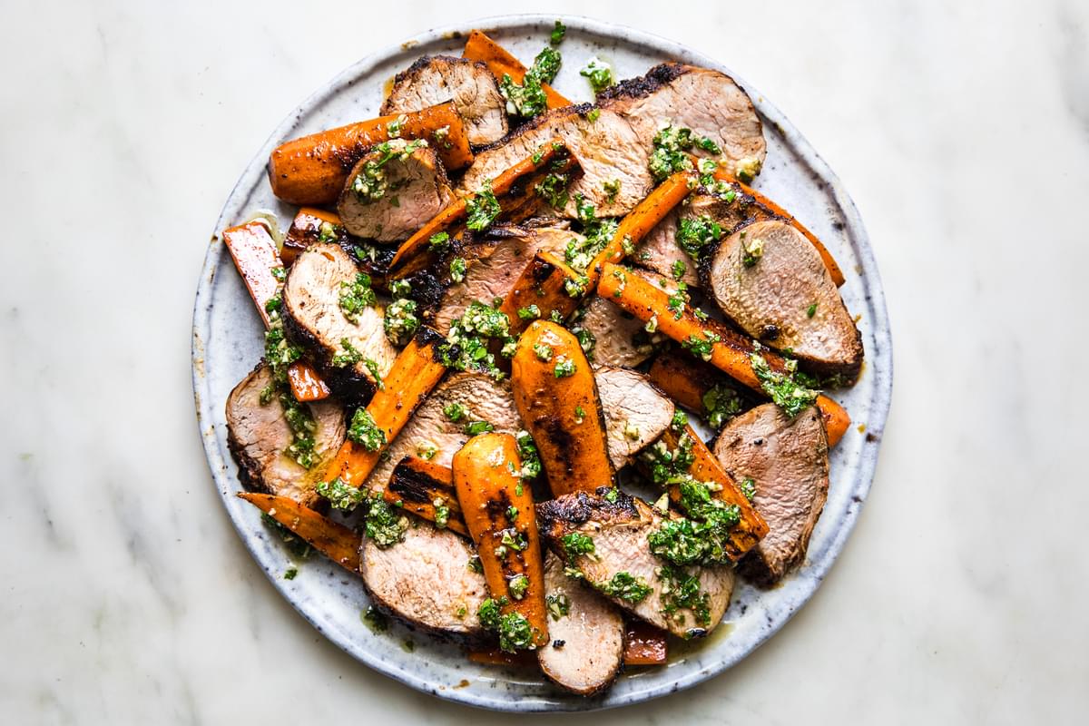 Grilled Pork Tenderloin with Carrots and Chermoula on a plate