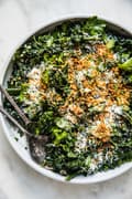 Kale Salad with Lemon Parmesan Dressing with crispy panko in a bowl
