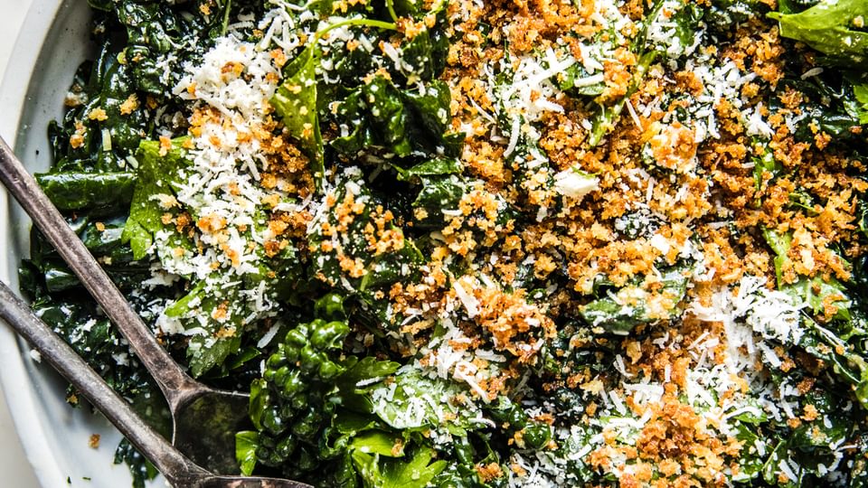 Kale Salad with Lemon Parmesan Dressing with crispy panko in a bowl