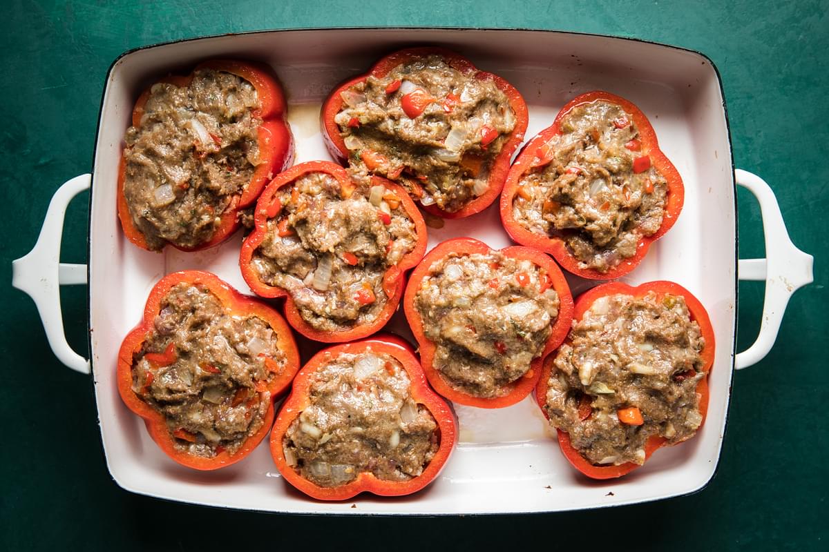 bell pepper rings filled with meatball filling in a 9x 13 baking dish
