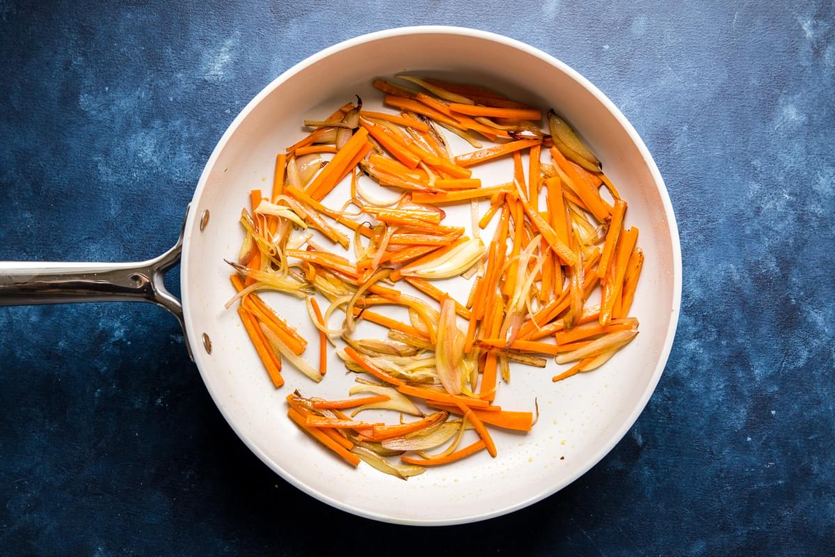 shallot and carrot cooked in a pan