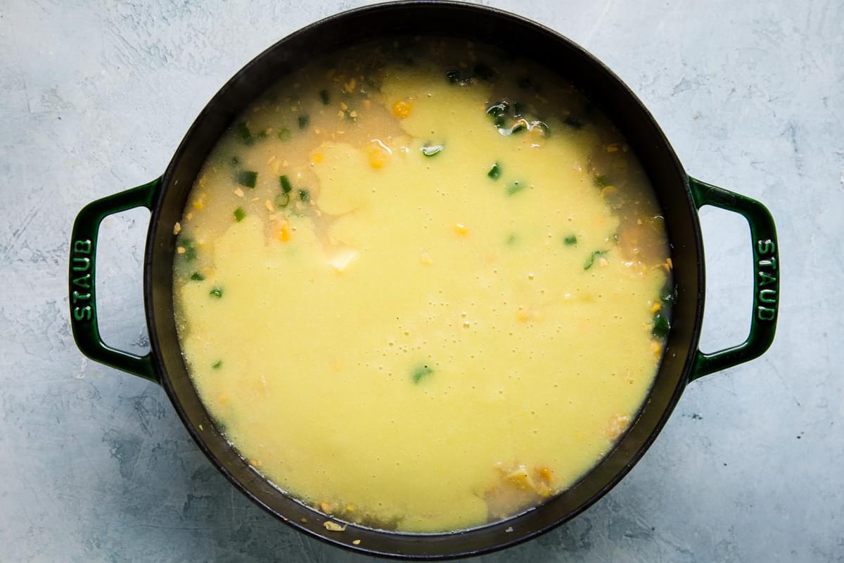 potato and corn chowder in a stock pot with the blended portion of the chowder added in