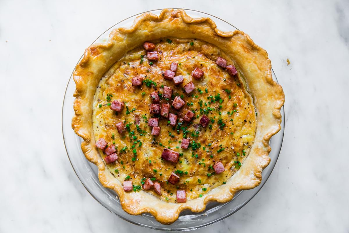 homemade quiche lorraine topped with diced ham