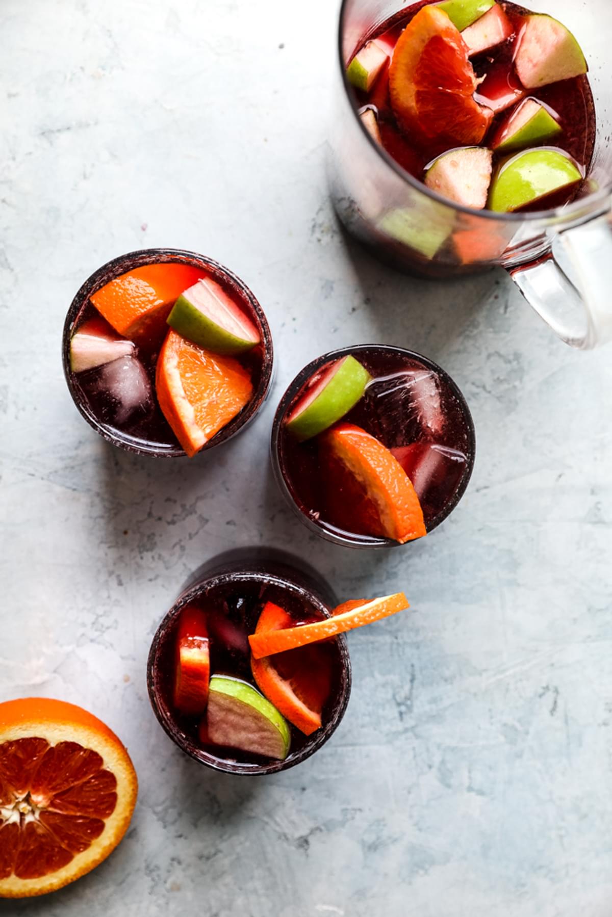 Homemade Red Wine Sangria Recipe with cinnamon, apples, oranges, brandy and triple sec.