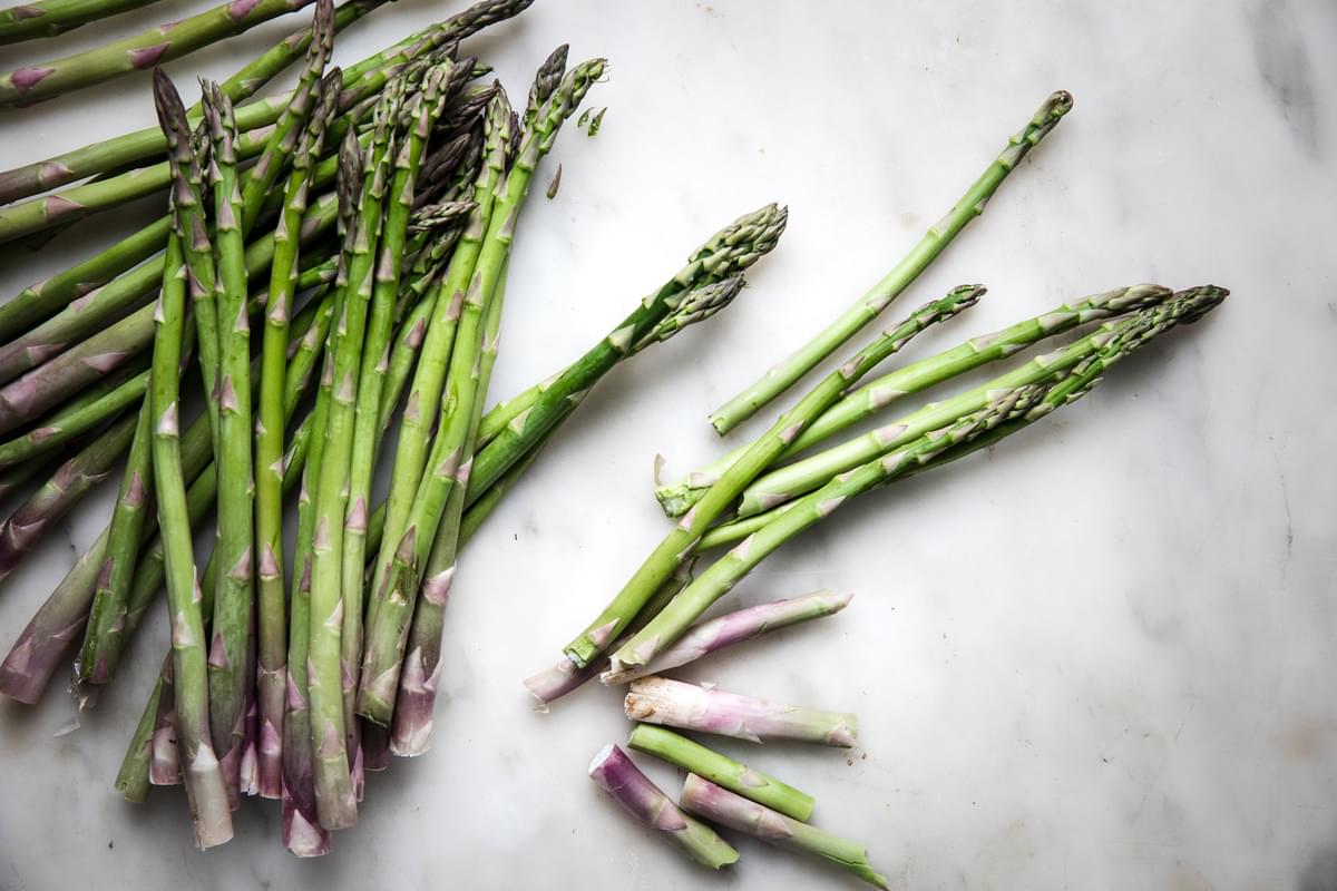 raw asparagus spears on the counter