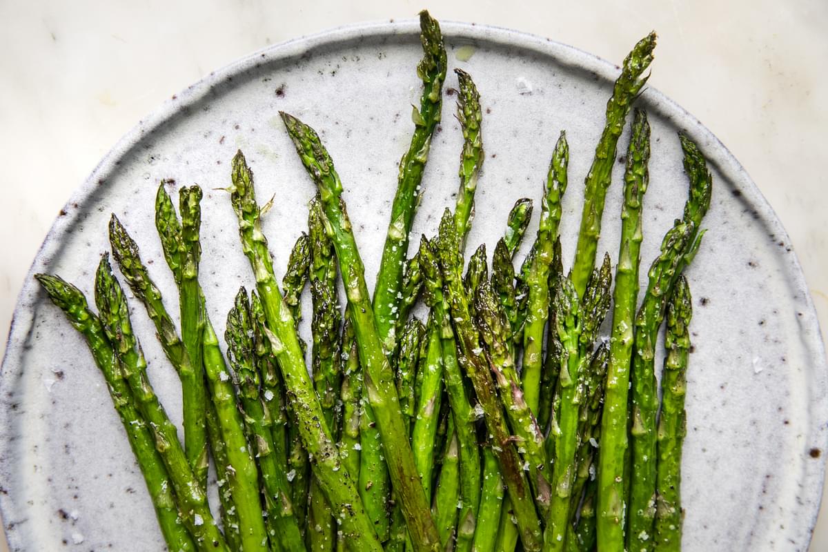 homemade roasted asparagus on a serving plate