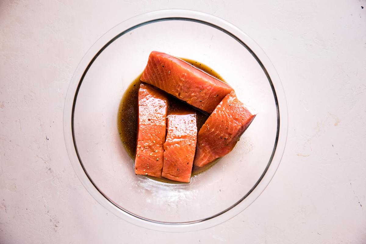 salmon in a bowl with ponzu, brown sugar, garlic powder, ginger, sesame oil and cornstarch