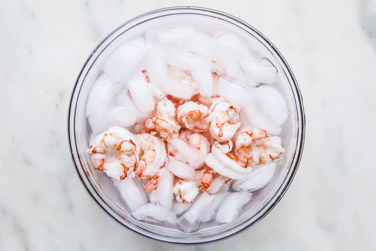 cooked shrimp in a bowl of ice