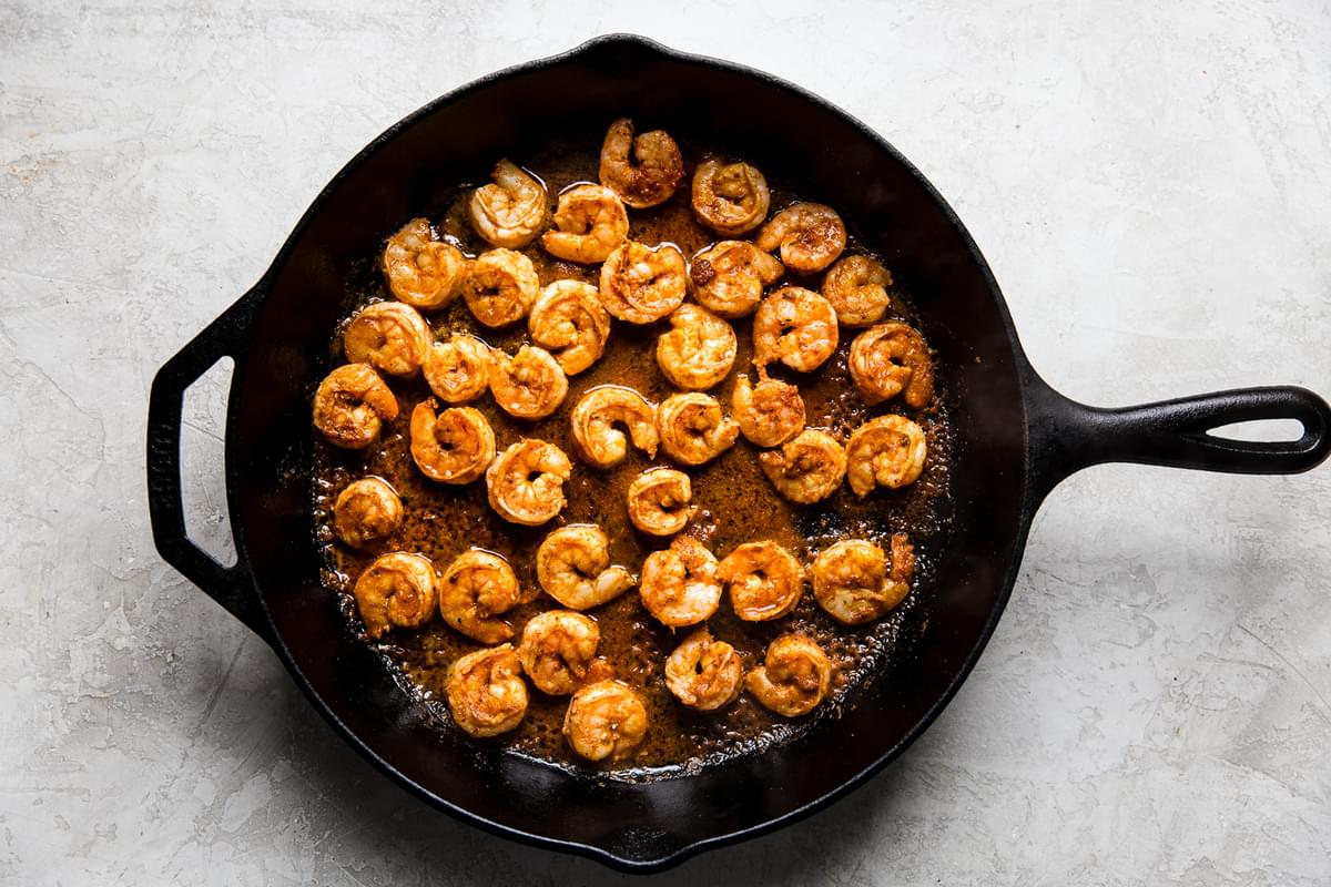 shrimp with taco seasoning and lime juice cooked up in a cast iron skillet