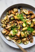 homemade Spicy Gnocchi with Fennel and Mushrooms in a bowl with a spoon