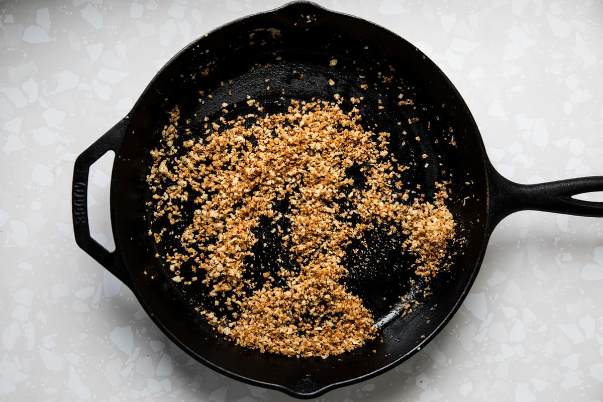 panko bread crumbs being toasted in butter in a skillet