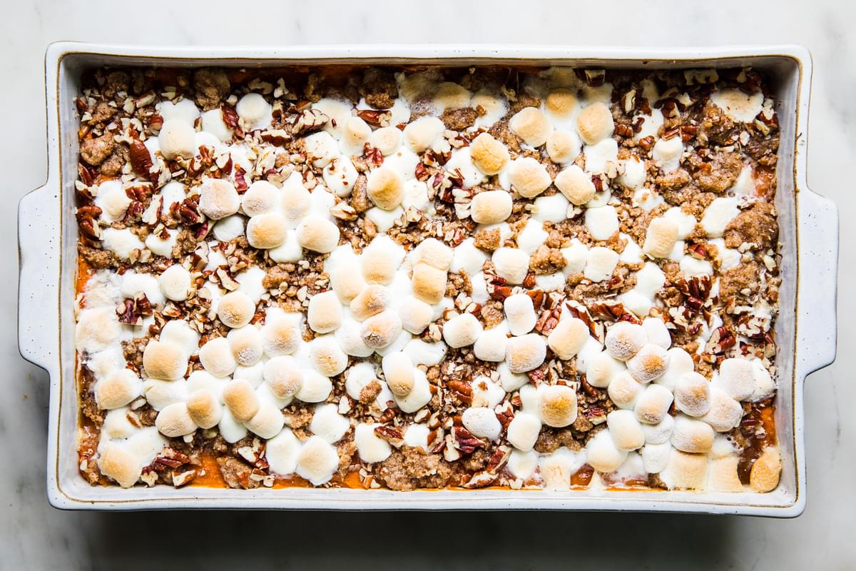 baked Homemade Sweet Potato Casserole with Marshmallows and Pecan Streusel in a baking dish
