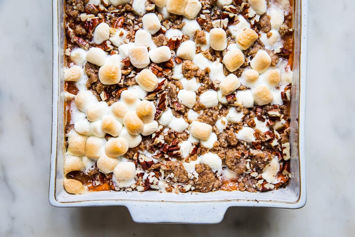 baked Homemade Sweet Potato Casserole with Marshmallows and Pecan Streusel in a baking dish