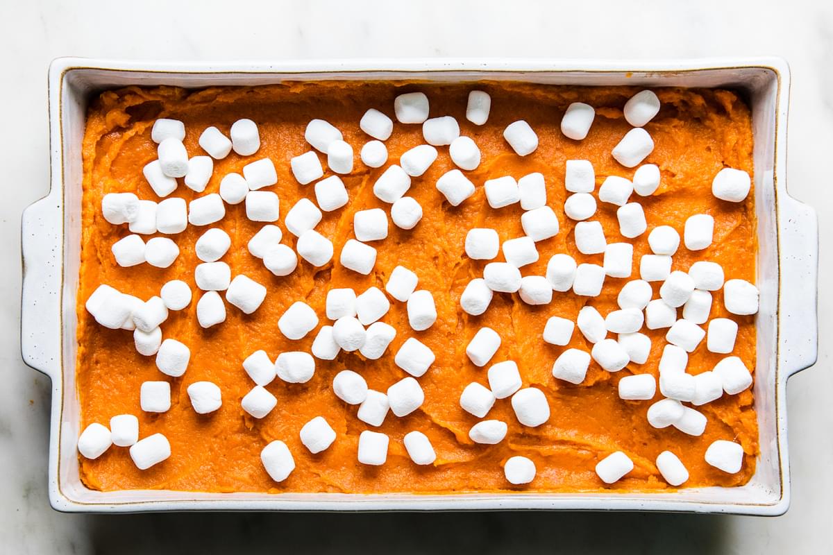 unbaked sweet potato casserole topped with marshmallows