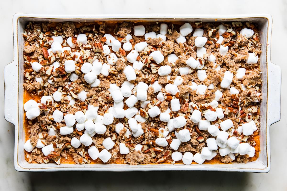 unbaked sweet potato casserole topped with marshmallows and pecan streusel topping