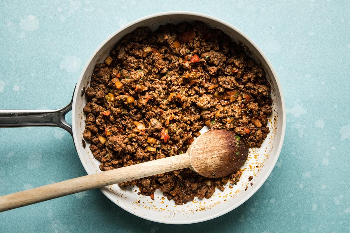 Ground beef cooked in a skillet with taco seasoning