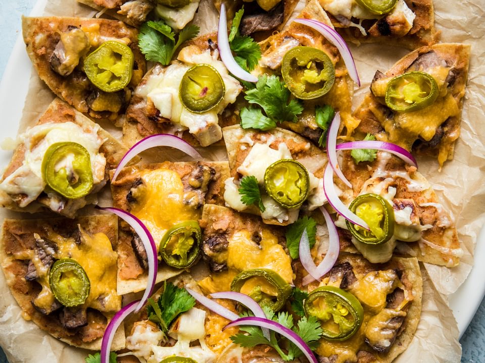 Texas Style Nachos with steak an chicken, cheese and jalapeño