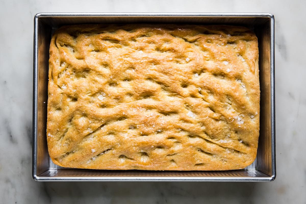 fresh baked focaccia bread recipe in a baking dish