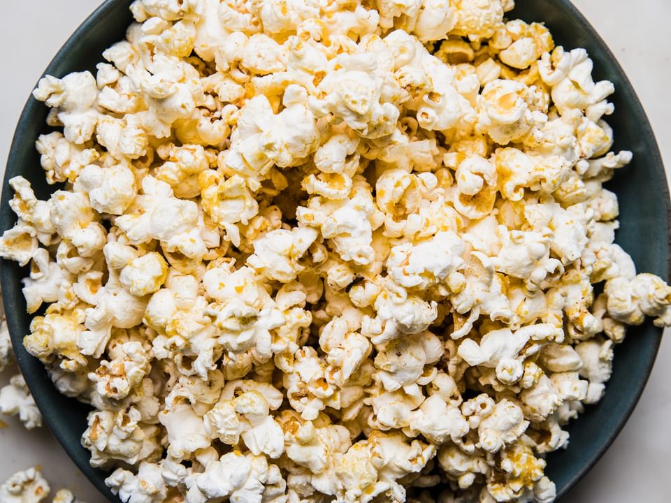 a bowl of homemade popcorn on the counter