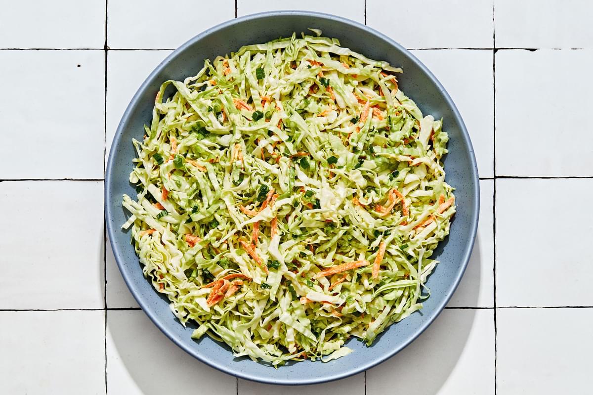 homemade classic coleslaw in a serving bowl on the counter