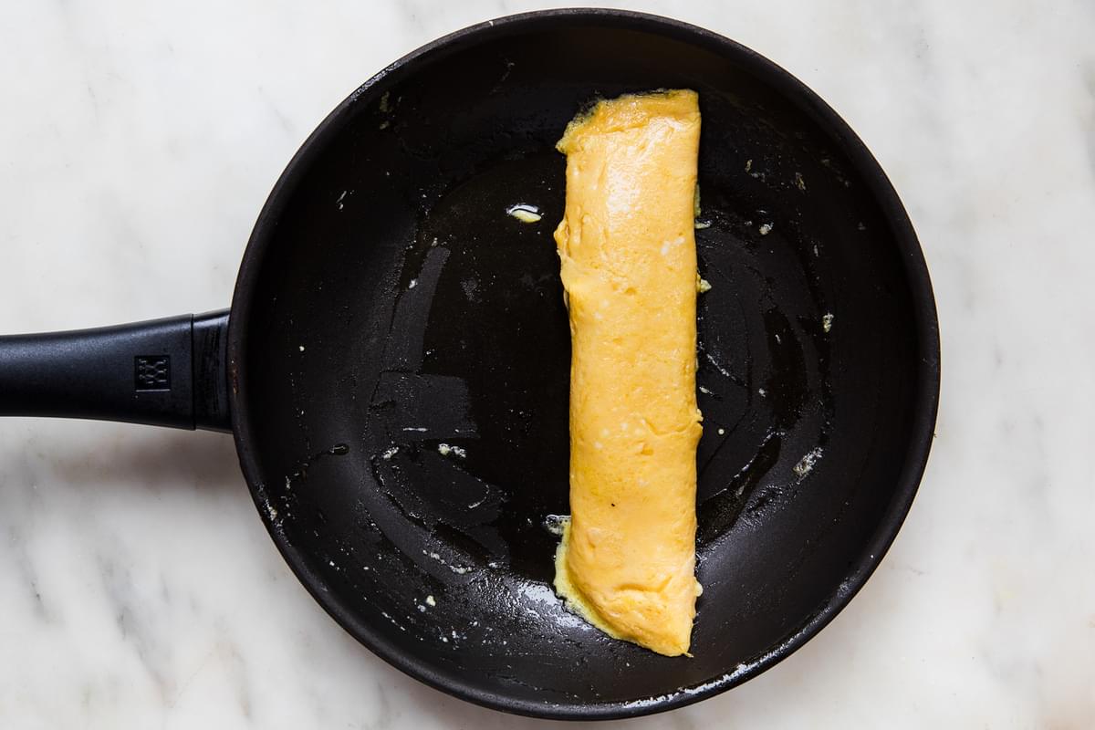 a homemade French omelette in a non stick frying pan