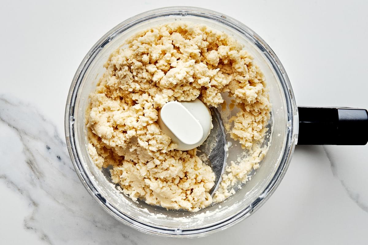 heavy cream, flour, baking powder, sugar, and salt that has been pulsed together in a food processor to make cobbler