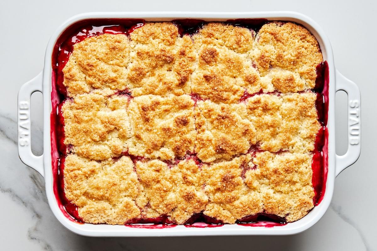 homemade fresh berry cobbler hot out of the oven made with strawberries, blackberries, blueberries and raspberries