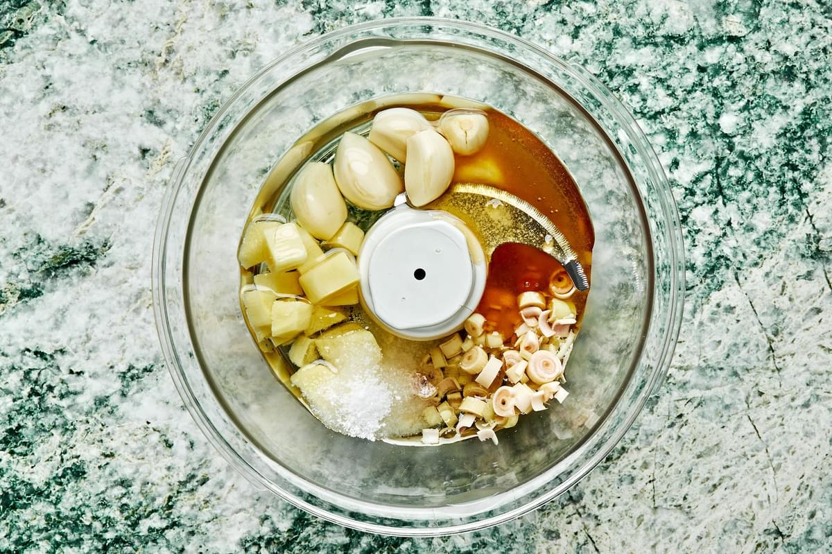 ginger, garlic cloves, lemongrass, honey, neutral oil and salt in a food processor to make lemongrass paste for chicken