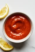 homemade cocktail sauce in a bowl made with ketchup, horseradish, Worcestershire, Dijon, Tabasco, applesauce & lemon zest
