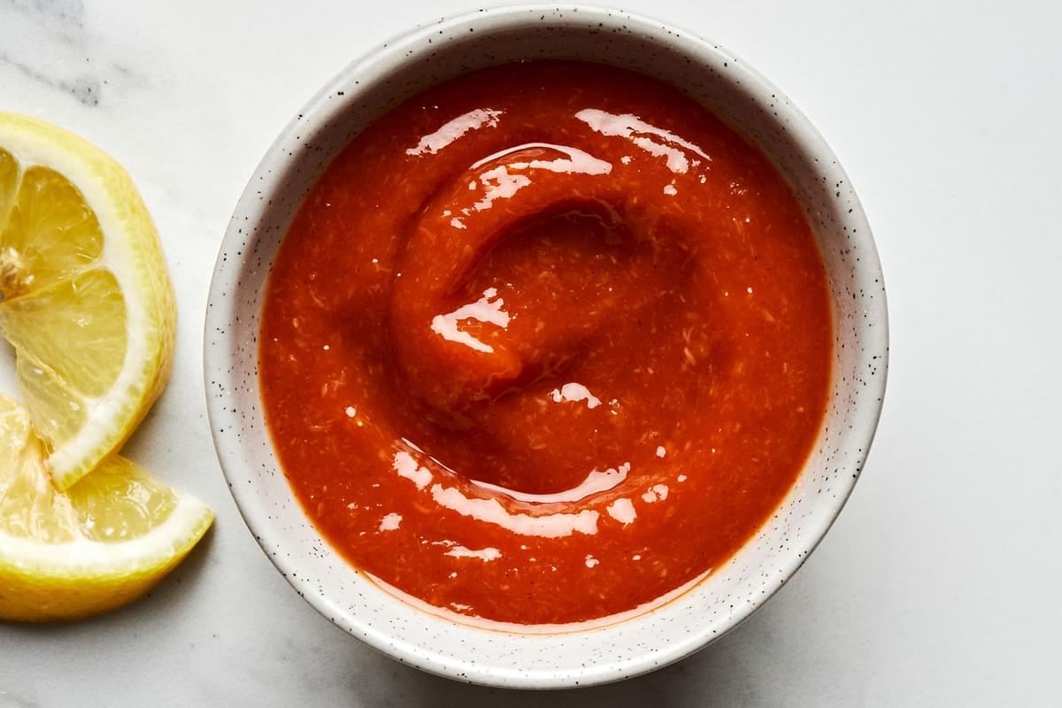 homemade cocktail sauce in a bowl made with ketchup, horseradish, Worcestershire, Dijon, Tabasco, applesauce & lemon zest