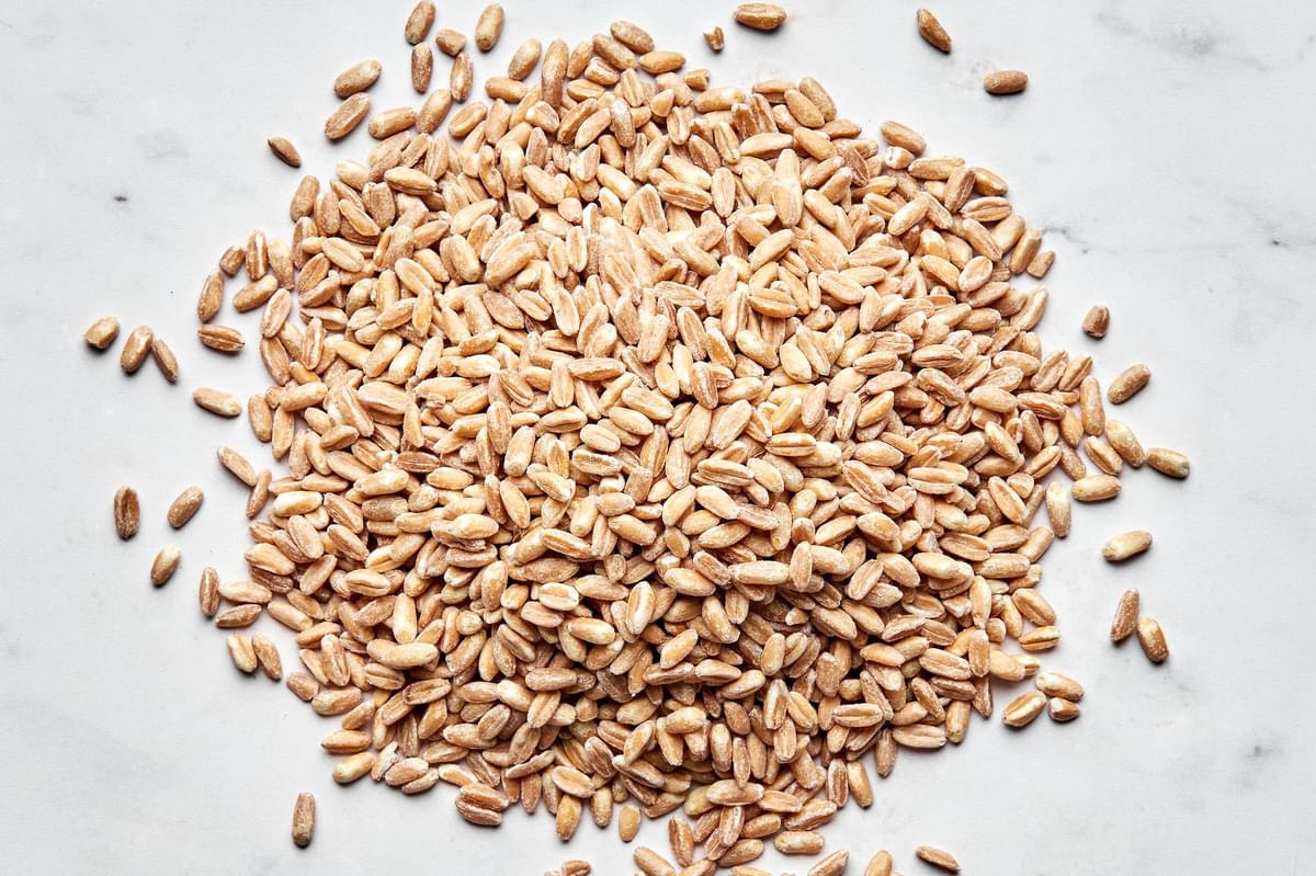 dry farro in a pile on the counter ready to be cooked