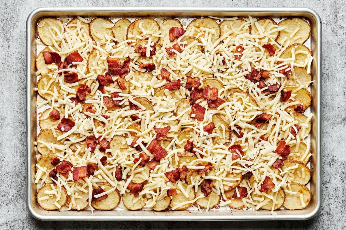 seasoned roasted potatoes topped with mozzarella cheese and cooked bacon for Irish nachos