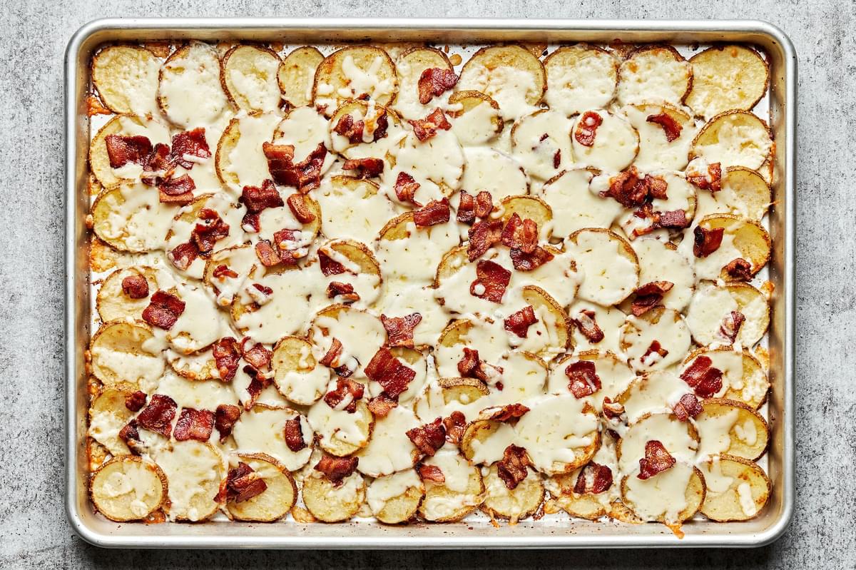 Irish nachos topped with melted mozzarella cheese and cooked diced bacon