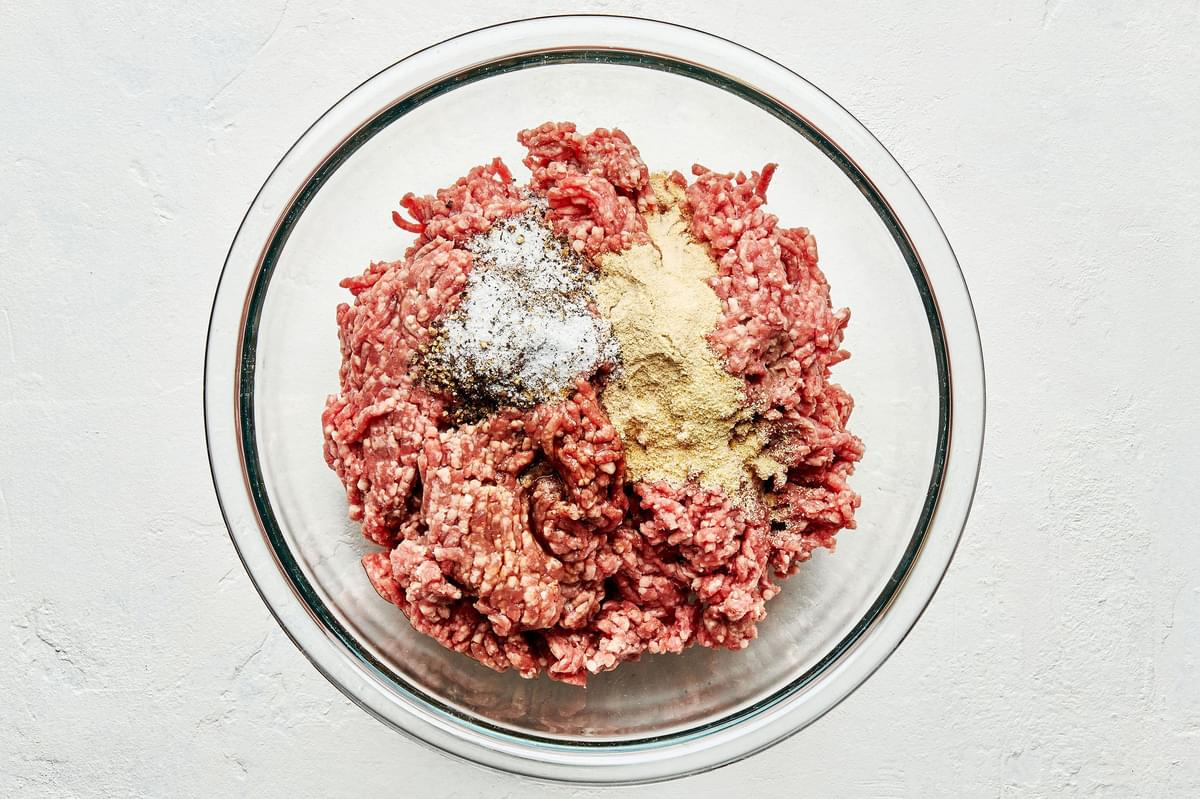 ground lamb, Worcestershire sauce, onion powder, garlic powder, salt and pepper in a bowl to make lamb burgers